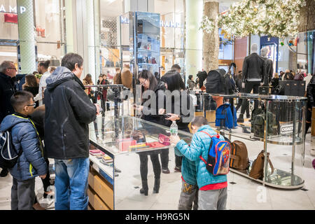 Shoppers browse Coach handbags in the Macy's Herald Square flagship store  on Sunday, March 26, 2017. Tapestry, the owner of the Coach and Kate Spade  brands, announced that revenue per handbag rose