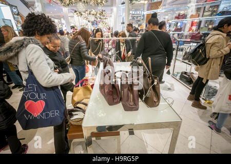 Shoppers browse Michael Kors handbags in the Macy&#39;s Herald Square Stock Photo: 136823744 - Alamy
