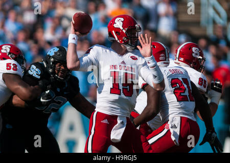 Chapel Hill, North Carolina, US. 25th Nov, 2016. Nov. 25, 2016 - Chapel Hill, N.C., USA - North Carolina State Wolfpack quarterback Ryan Finley (15) throws during the first half of an NCAA football game between the North Carolina Tar Heels and the N.C. State Wolfpack at Kenan Memorial Stadium in Chapel Hill, N.C. N.C. State won the game 28-21. © Timothy L. Hale/ZUMA Wire/Alamy Live News Stock Photo