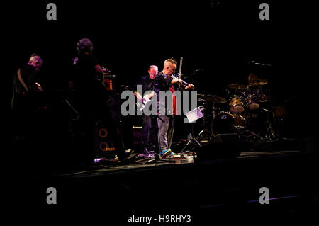 Brighton, East Sussex, UK. 25th November 2016. Violinist Nigel Kennedy performs live at Brighton Dome for a UK exclusive concert to play the music of Jimi Hendrix. The concert was presented by Rye International Jazz & Blues Festival as part of their festival programme. Kennedy’s band included guitarists Doug Boyle (Robert Plant collaborator) and 18-year-old prodigy Julian Buschberger, bassist Tomasz Kupiec and drummer Adam Czerwinski. Credit:  Francesca Moore/Brighton SOURCE/Alamy Live News Stock Photo