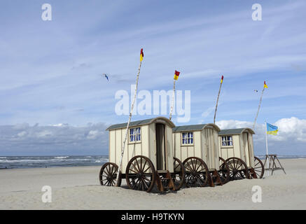 Old bathing carts used as changing rooms on the eastern beach, Norderney, Lower Saxony, Germany Stock Photo
