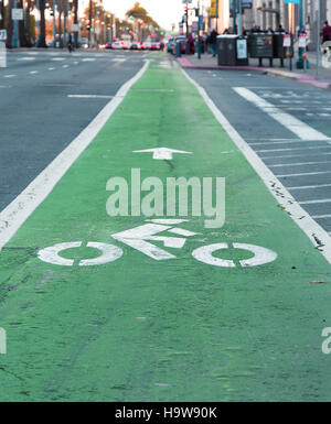 Green painted cycle lane and white cycle symbol on road in Porthmadog ...