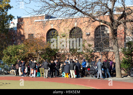 New York, United States of America - November 17, 2016: Chinese people gahering in public park in Chinatown to play games Stock Photo