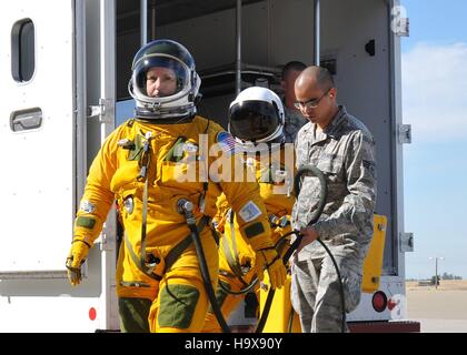 U.S. Air Force Secretary Deborah Lee James walks to a U-2S Dragon Lady ultra-high altitude reconnaissance aircraft as U.S. soldiers carry her high-altitude pressure suit equipment at the Beale Air Force Base August 11, 2015 near Marysville, California. Stock Photo