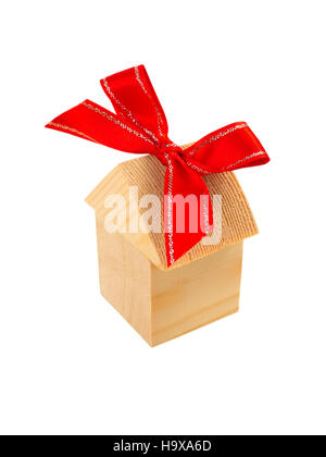 Wooden building blocks home and red ribbon bow isolated on white Stock Photo