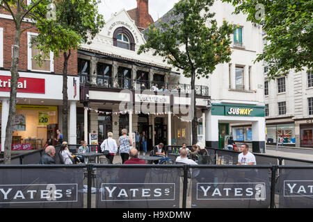 People drinking outside the Yates's pub in Nottingham city centre, England, UK Stock Photo