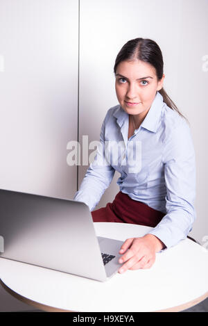 Young woman working on computer at office Stock Photo