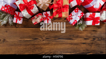 Christmas gift boxes placed on wooden planks. Copyspace for text Stock Photo