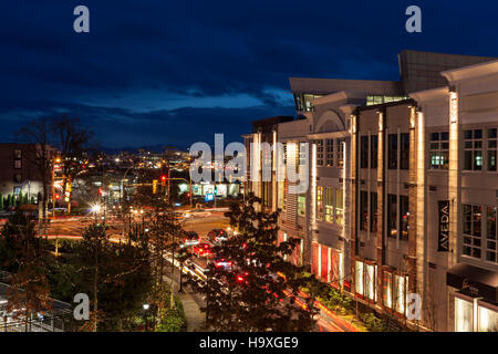 Entrance to Uptown Shopping Mall and commuter traffic at twilight-Victoria, British Columbia, Canada. Stock Photo