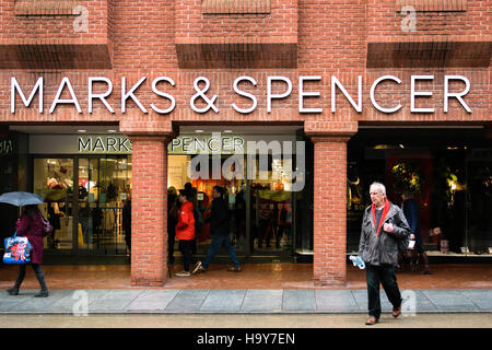 Exeter, England, UK - 22 November 2016: Unidentified people walk by Marks & Spencer store on High Street. Stock Photo