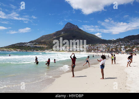 local people on Camps Bay Beach, Cape Town, South Africa Stock Photo