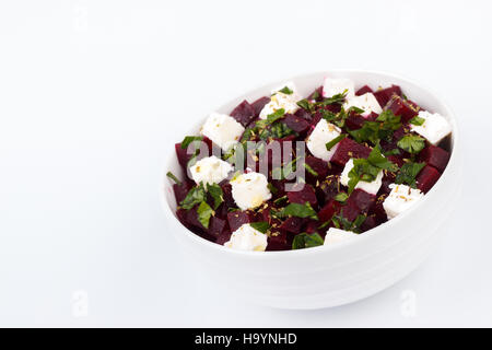 Beetroot salad with feta and olive oil isolated over white background Stock Photo