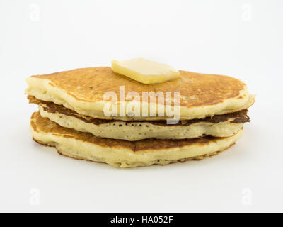Pancakes in Stack with Pat of Butter on White Stock Photo