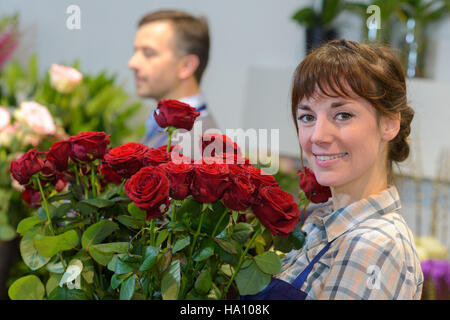 holding a bunch of roses Stock Photo