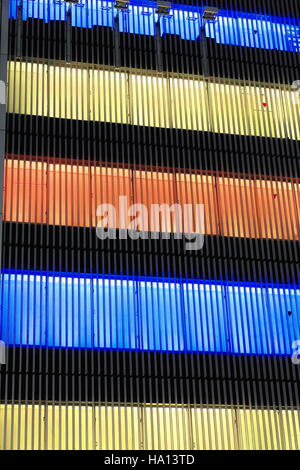 Blue-yellow-orange lights on at night of postmodern architecture building in Ginza ward at the Sukiyabashi crossroads on Harumi-dori illuminating Stock Photo