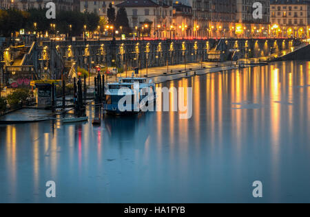 Turin (Torino) scenic view on Murazzi and River Po at twilight Stock Photo