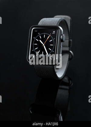 Shiny steel Apple Watch series 2 smartwatch with analog clock dial on display isolated on black background Stock Photo