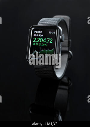 Apple Watch smartwatch with stock market app on display isolated on black background Stock Photo