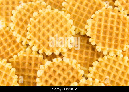 Bunch of golden baked waffle cookies background Stock Photo