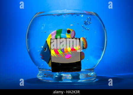 Ceramic fish in a fish bowl Stock Photo