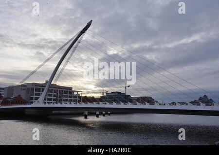 Opened in 2009, the harp shaped Samuel Beckett Bridge over the River Liffey in Dublin is a cable-stayed bridge. Stock Photo