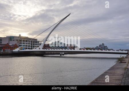 Opened in 2009, the harp shaped Samuel Beckett Bridge over the River Liffey in Dublin is a cable-stayed bridge. Stock Photo