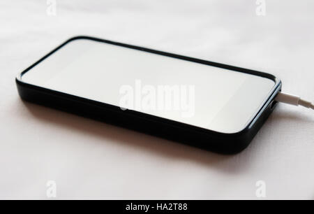 black mobile phone / smart phone charging Stock Photo