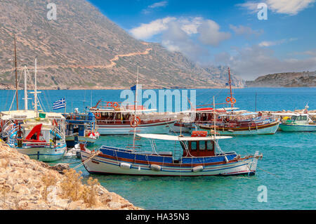 Traditional greek fishing boats in port near Aghios Nikolaos town on Crete island Stock Photo