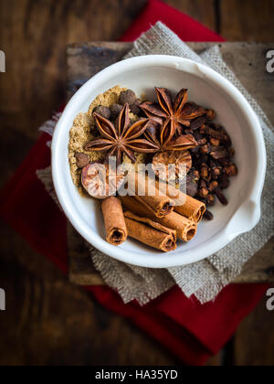 Spices for making gingerbread spice mix placed in a mortar. View from the above. Stock Photo