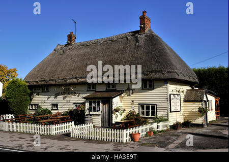 A typical country thatched pub at Hatfield Heath in the Essex countryside, United Kingdom, Europe Stock Photo