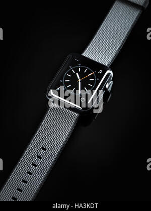 Apple Watch smartwatch with analogue clock dial on display isolated on black background Stock Photo