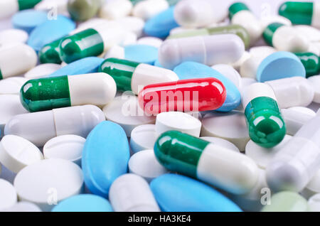 Medical theme. Plenty of colorful pills and capsules. Closeup Stock Photo