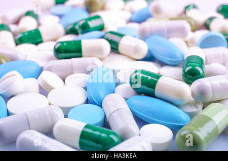 Medical theme. Plenty of colorful pills and capsules. Closeup Stock Photo