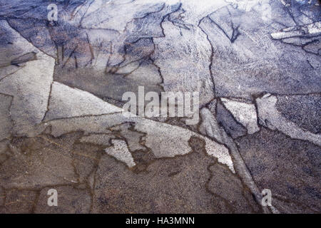 Patterns on a Canadian lake in early fall as ice forms before the first snow. Stock Photo