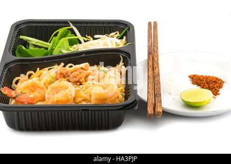 Thai style stir fried rice noodles with shrimps on white background Stock Photo