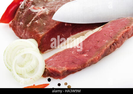 Slicing rump steak Stock Photo