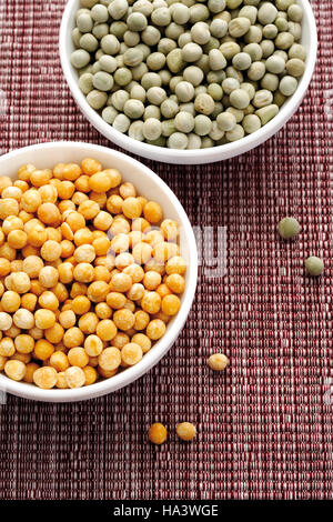 Different types of dried peas in bowls Stock Photo