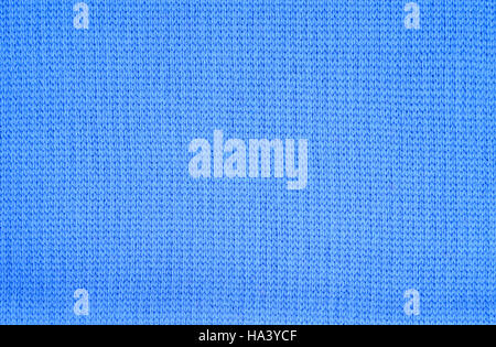Blue knitted fabric as a seamless background Stock Photo