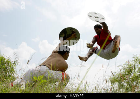 Men practicing Kalaripayattu, traditional martial art of Kerala, Southern India Stock Photo