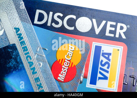 Close up of credit cards with Discover,American Express,visa and MasterCard logos on white background,illustrative editorial Stock Photo
