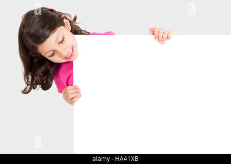 Cute girl showing blank white board for advertising Stock Photo