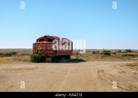 An old diesel locomotive stands abandoned at Marree in the Australian Outback Stock Photo