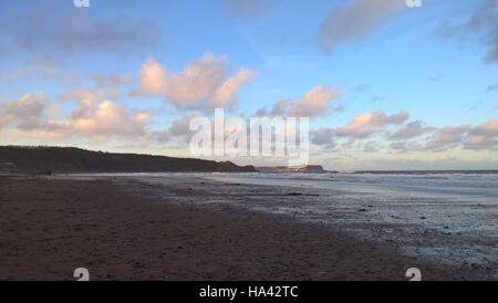 Cloud Reflections on the sand in Cayton Bay Stock Photo