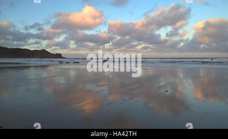 Cloud Reflections on the sand in Cayton Bay Stock Photo