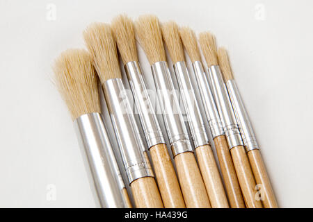 A set of artists brushes on a plain white background, different sizes and widths. Stock Photo