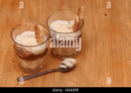 Vanilla chocolate pudding dessert with a cream filled sandwich cookie Stock Photo