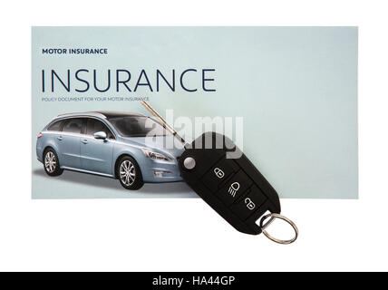 Certificate of motor insurance and policy schedule with car key Stock Photo