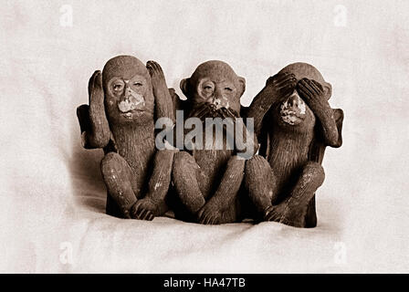 The proverbial statue of three monkeys - see no evil, hear no evil, speak no evil. Stock Photo