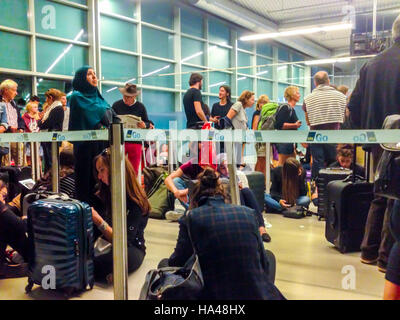 San Francisco, CA, USA, Inside, Large Crowd People, Tourists ,Airline Passengers Queuing up in Terminal, Late Plane at Night, overtourism Stock Photo