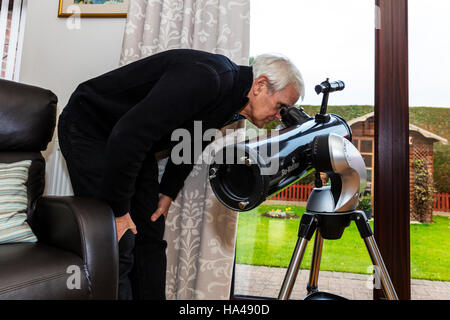 Looking through telescope in daytime spying on neighbours neighbors UK